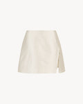 Anya Mini Skirt in Feather White, a wool silk mini skirt with faux-wrap front, side slit and bead detail.