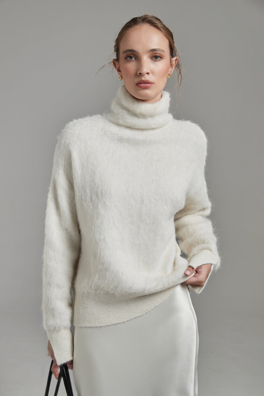 The Lauren Turtleneck in Feather White shown front-on with long sleeves, a brushed alpaca-blend texture and soft stretch.