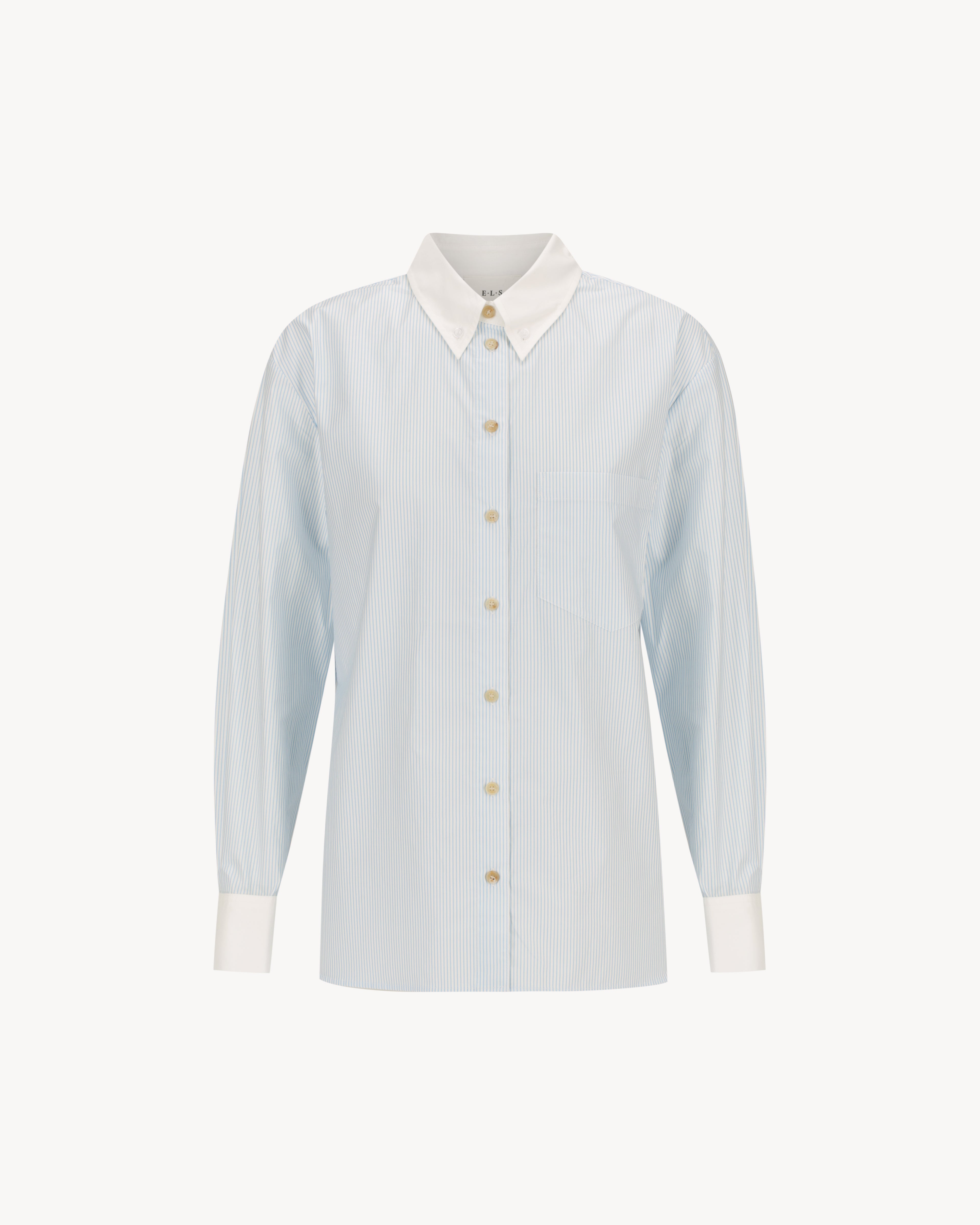 Margot Shirt – All Tied Up in light blue and white pinstripe, a cotton button-down shirt with internal tie-back waist shaping.
