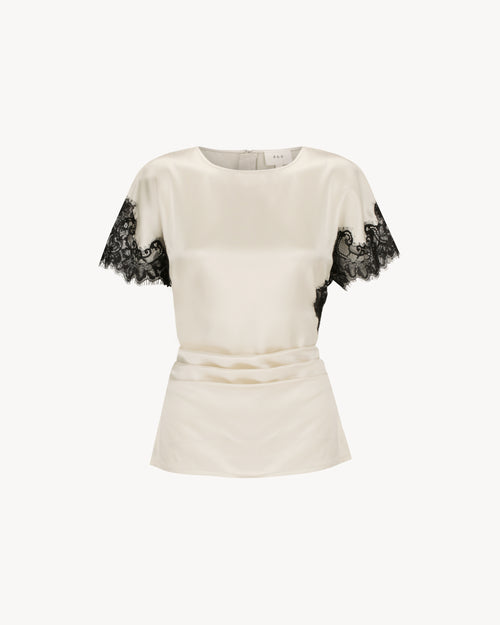 Paloma Top in Feather White, a satin lace panel top with black lace detailing and fitted silhouette.