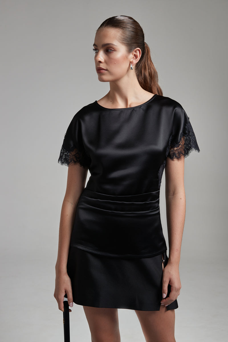 The Paloma Top in Midnight Black shown from the front with tonal lace panel detailing and a fitted silhouette.