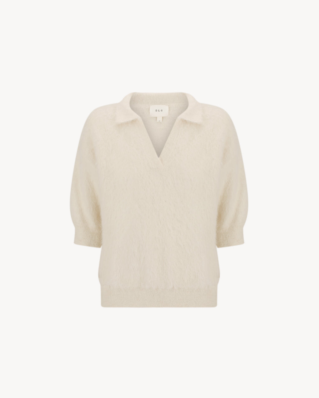Stella Polo Knit in Feather White, an alpaca polo knit with short sleeves, brushed texture and soft stretch.