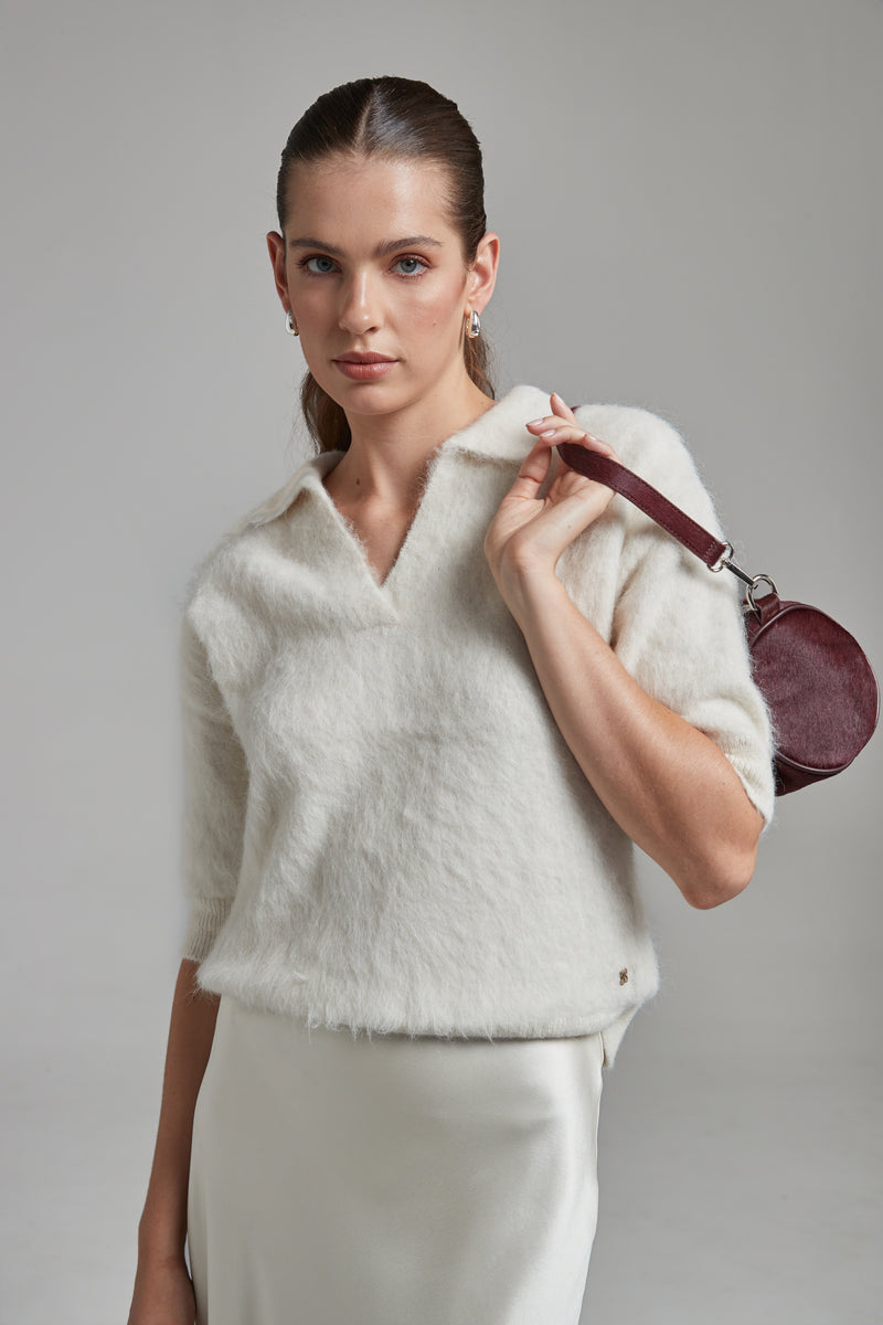 The Stella Polo Knit in Feather White shown front-on with short sleeves, a brushed alpaca-blend texture and soft stretch.