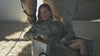 he Celeste Trench Coat in Desert Taupe, a cotton trench coat shown in a campaign video with structured outerwear styling and an outdoor horse setting.
